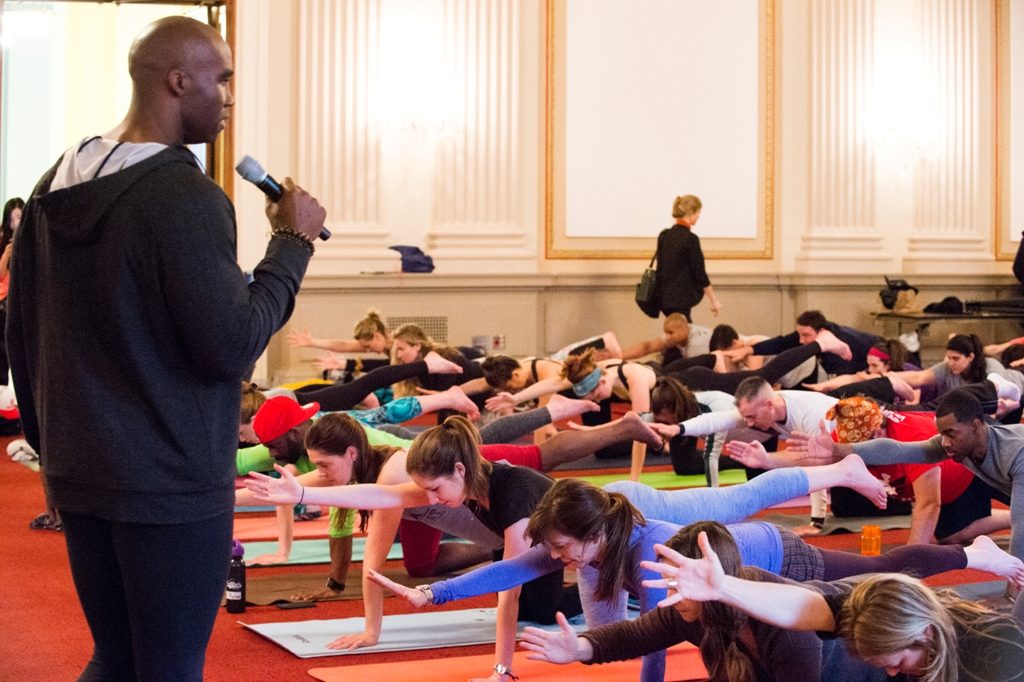 Keith Mitchell, former US National Football League (NFL) pro and a celebrity yogi, leading the first ever “Yoga on the Hill” event. Photo: IANS