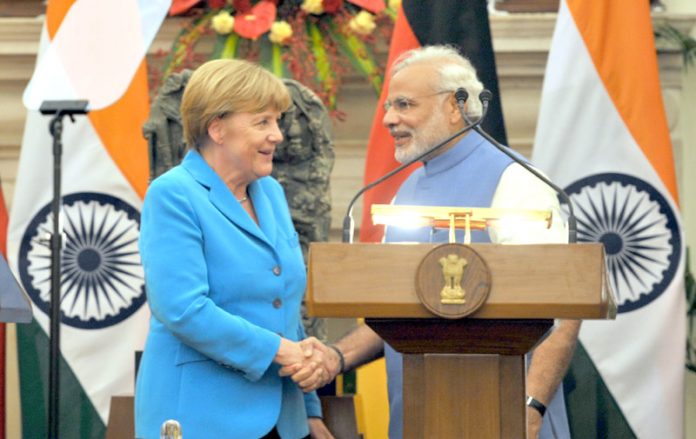 Modi with merkel in India