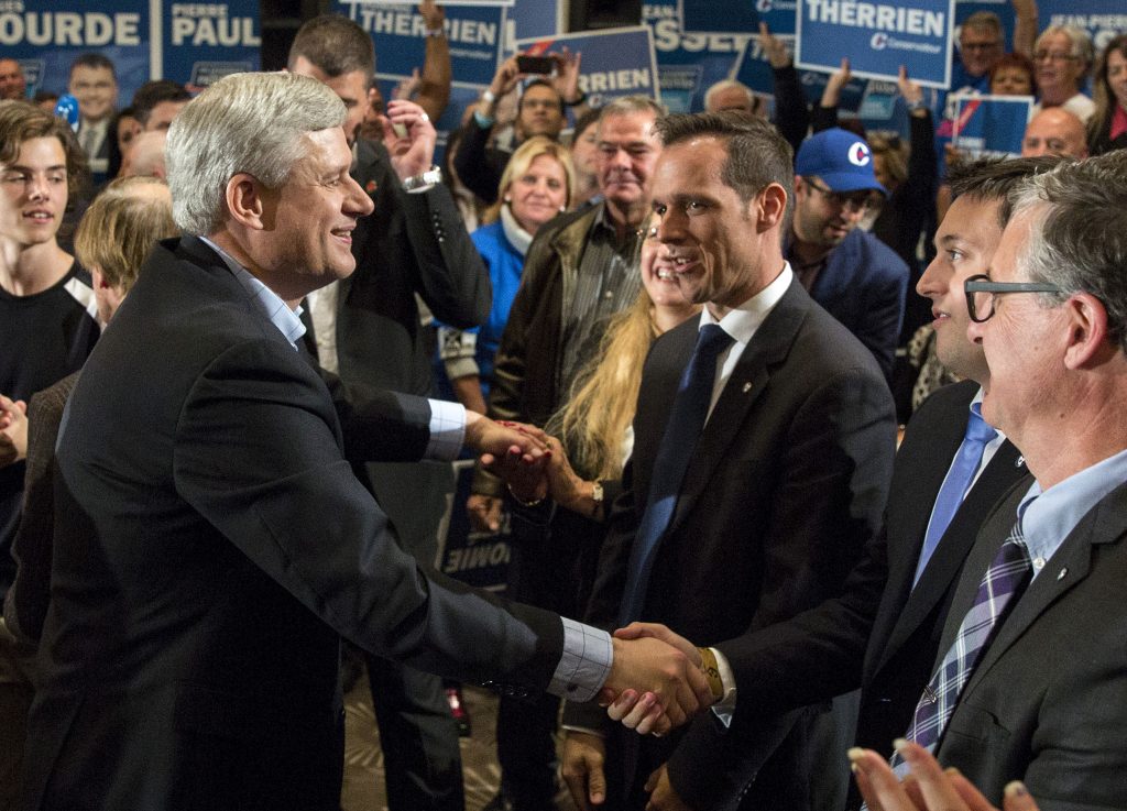 Prime Minister Stephen Harper shakes hands with supporters at a rally in Quebec City, September 30, 2015. CPC Photo by Jill Thompson