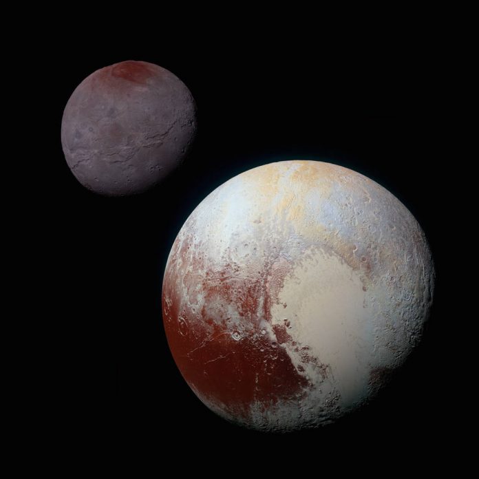 This composite of enhanced colour images of Pluto (lower right) and Charon (upper left) was taken by the New Horizons spacecraft. (Photo- NASA)