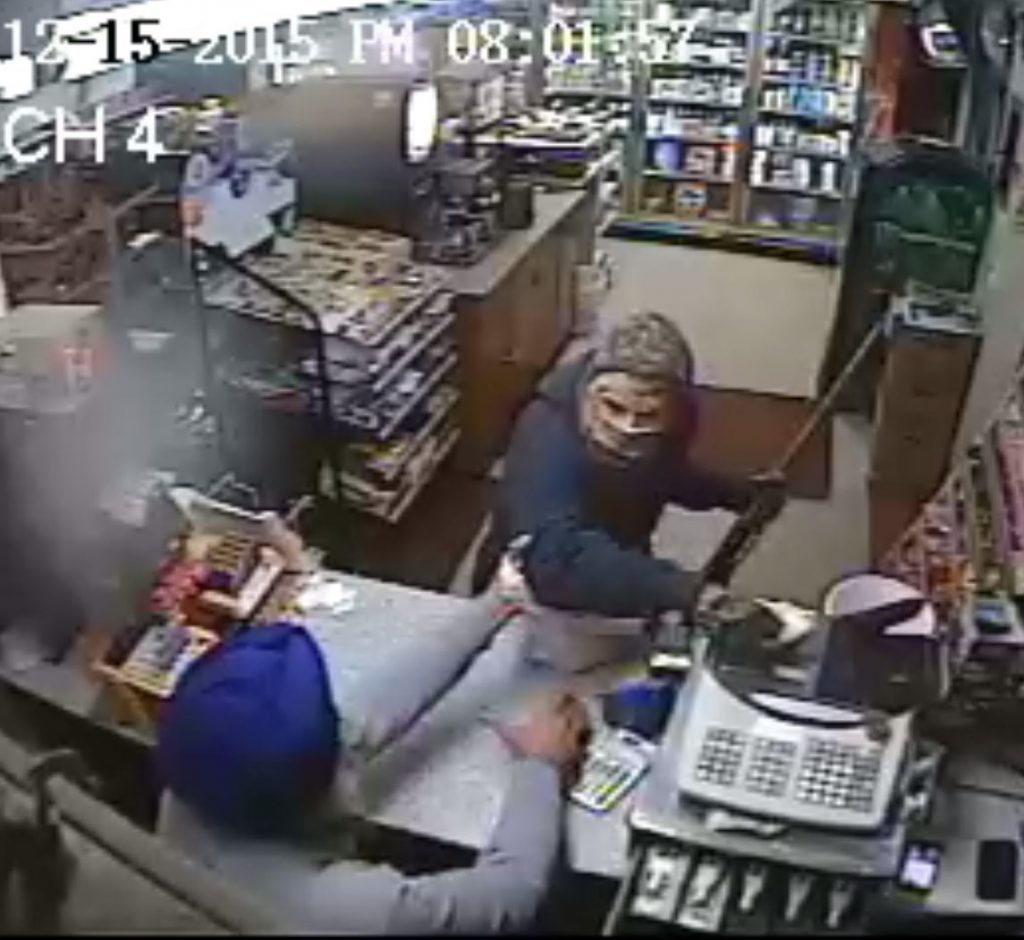 Amrik Singh is seen confronting a masked gunman Tuesday (Dec. 15, 2015) at his petrol station in Staatsburg, about 160 km from New York City, in a still from a surveillance video. Singh threw a slipper at the gunman trying to rob the store ,momentarily distracting him, and charged at him. The gunman fled after firing a shot that missed Singh. (Credit: Courtesy of New York State Police)