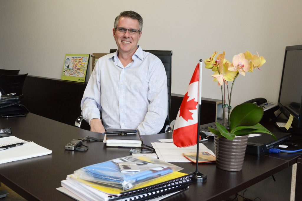 John Aldag in his office on the Fraser Highway on the Surrey Langley border. Photo by Ray Hudson