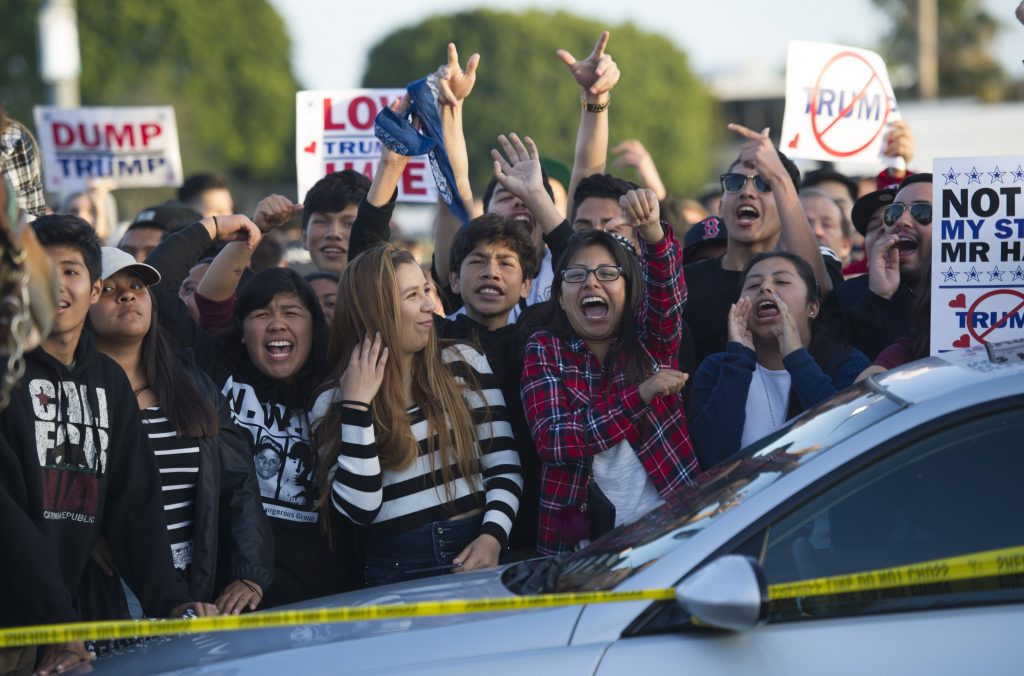 ORANGE COUNTY: April 29, 2016 (Xinhua) --Protesters shout outside a Donald Trump campaign rally in Orange County, southern California, April 28, 2016. Supporters and opponents of the Republican presidential front-runner Donald J. Trump confronted for a few hours on Thursday to express their different opinions. (Xinhua/Yang Lei)