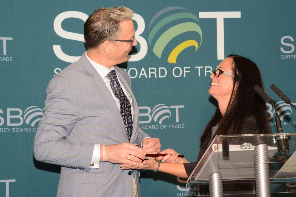 Dr. Greg Thomas, Incoming Chair receives the gavel from retiring Shelley Besse.