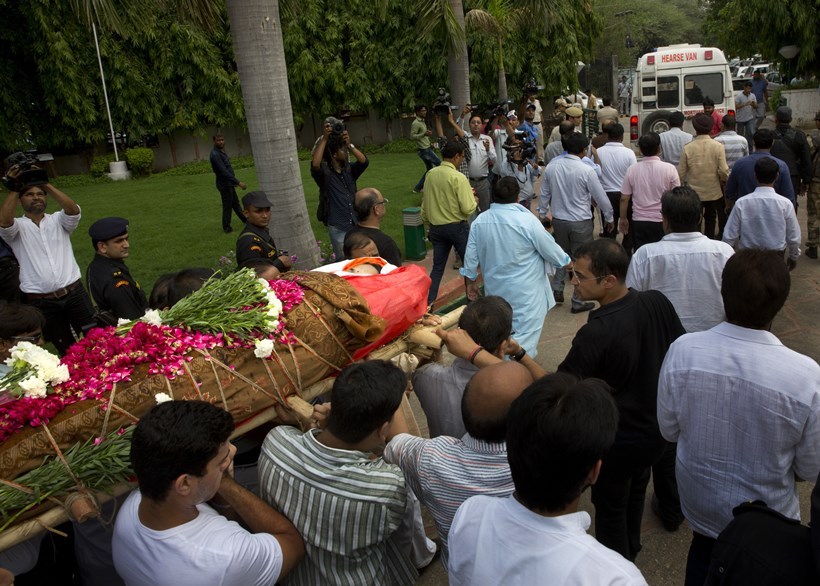 Relatives and friends of Tarishi Jain, a victim of the attack on Dhaka's Holey Artisan Bakery, carry her body for cremation in Gurgaon, in the outskirts of New Delhi, India, Monday, July 4, 2016. The brutality of the attack, the worst convulsion of violence yet in the recent series of deadly attacks to hit Bangladesh, has stunned the traditionally moderate Muslim nation and raised global concerns about whether it can cope with the increasingly strident Islamist militants. (AP Photo/Manish Swarup)