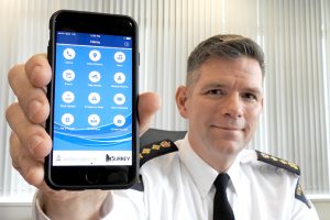 OIC C/Supt. Dwayne McDonald displays new Surrey RCMP App on his smartphone