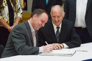 Education Minister Mike Bernier and Surrey Board Chair Shawn Wilson sign the memorandum of understanding with the terms of reference for the Surrey Executive Project Board.