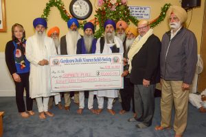 Participating in the event were (from left) Lenore Rattray- Sophie’s Place, Giani Narinder Singh, Head Priest, Gurdwara Dukh Nivaran Sahib Society Temple Executive members: Sadhu Singh, Sadhu Singh Nijjar, Seetalk Singh, Gurshinder Singh, Satnam Singh Durha, Jaswant Singh Bains, Steve Stew, a Director of Sophie’s Place, and Sarbjeet Singh. Photo: Ray Hudson