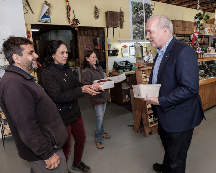 Premier Horgan at Mariposa Farms fruit stand